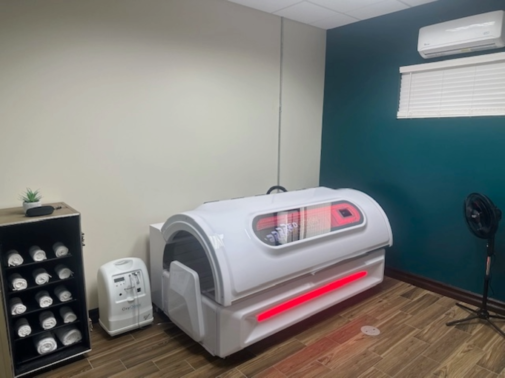 Client relaxing in the Red Light Therapy bed in Willis TX.