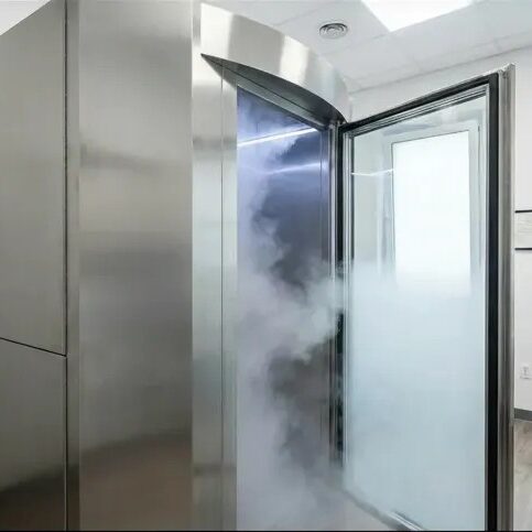A premium whole body cryotherapy machine releasing cooling vapor at LifeRx Wellness center in Willis, Texas