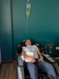 A client relaxing in a zero-gravity massage chair while receiving IV Therapy in Willis TX at LifeRx Wellness.